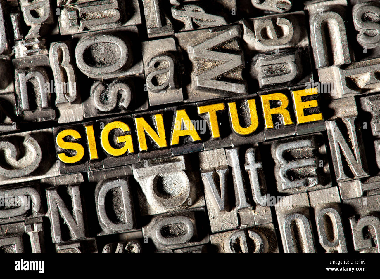 Old lead letters forming the word 'SIGNATURE' Stock Photo
