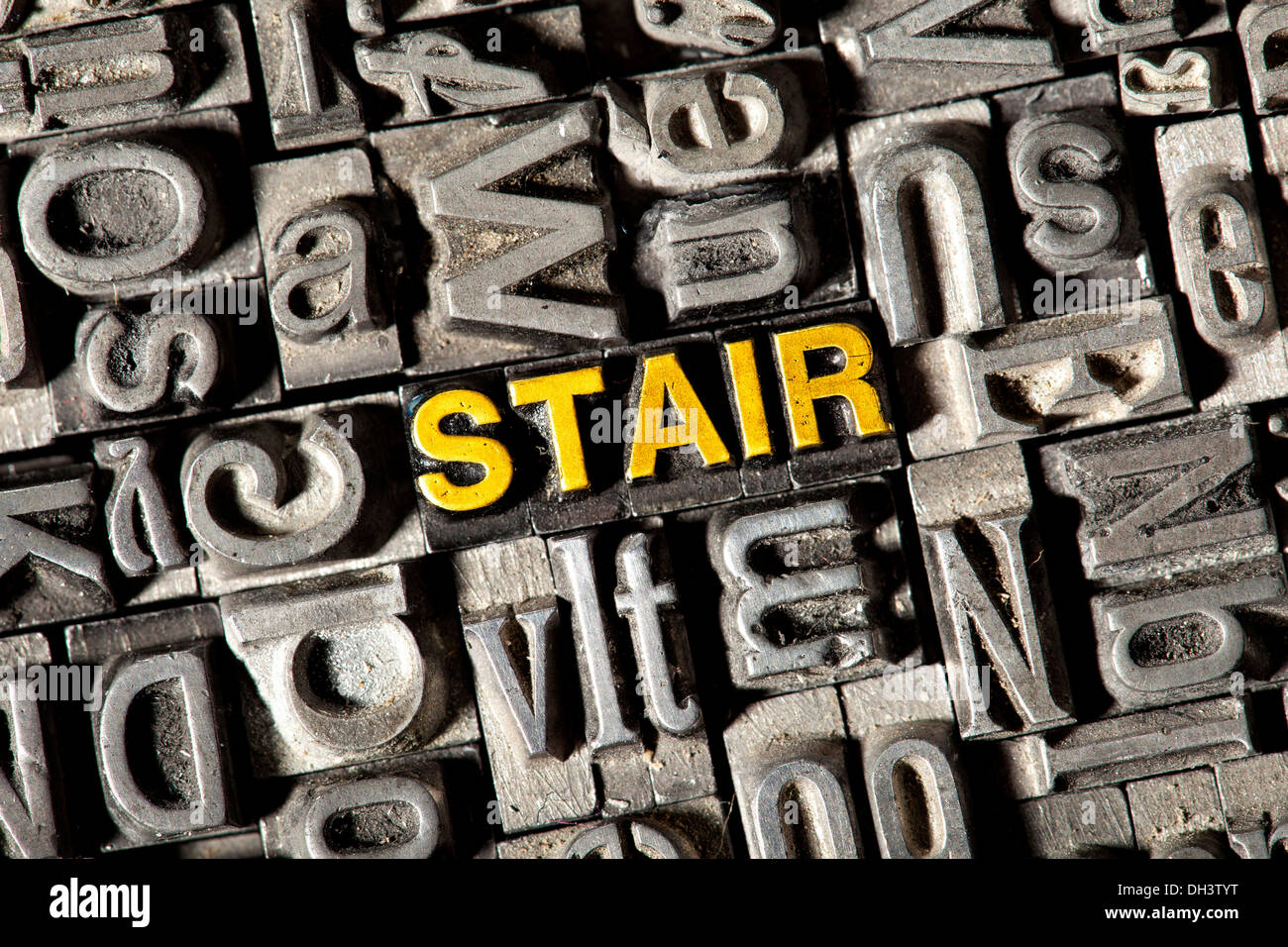 Old lead letters forming the word 'STAIR' Stock Photo
