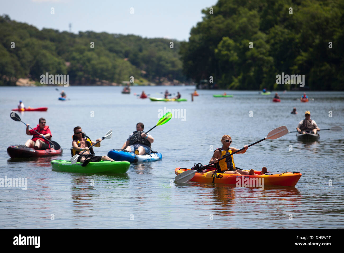 Kayakers paddling on a lake in Bella Vista, Arkansas, USA. Stock Photo