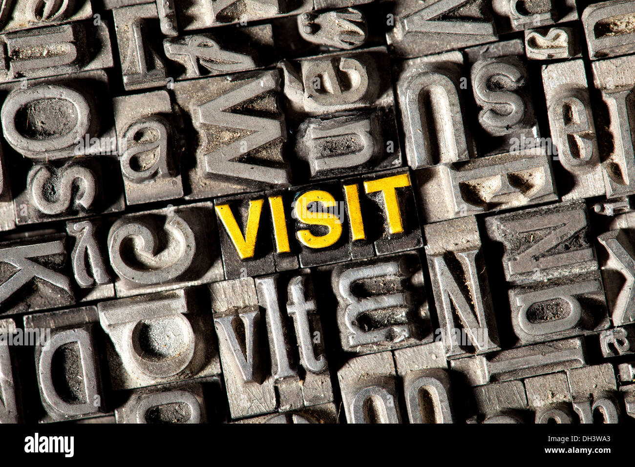 Old lead letters forming the word Visit Stock Photo