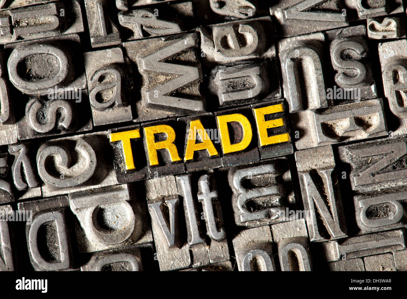 Old lead letters forming the word Trade Stock Photo