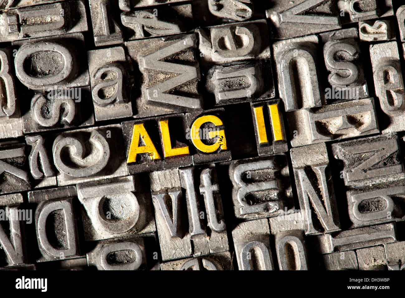 Old lead letters forming the term 'ALG II', for the German unemployment assistance Stock Photo