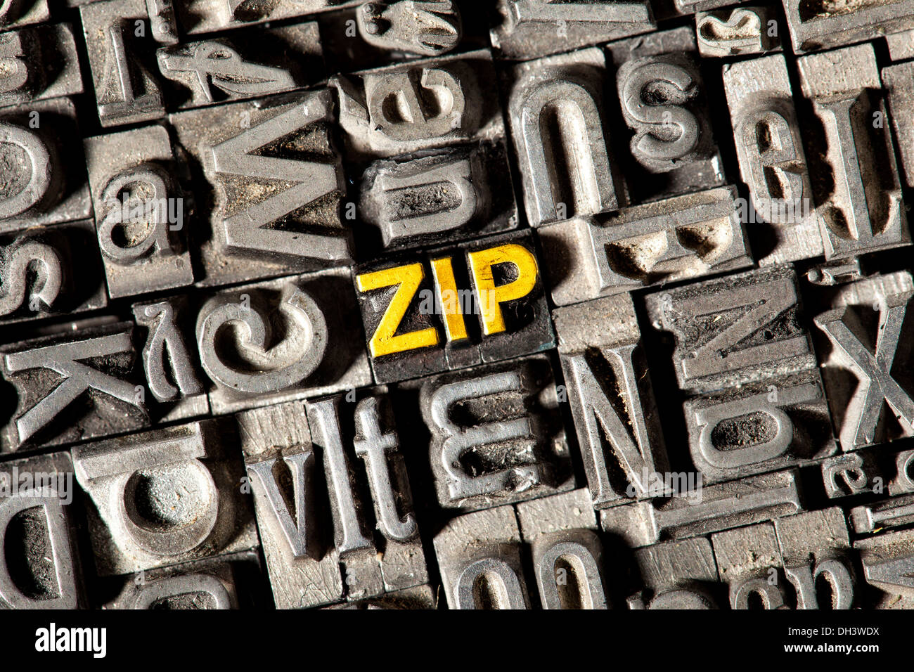 Old lead letters forming the word 'zip' Stock Photo