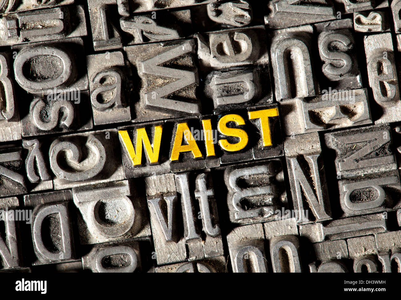 Old lead letters forming the word Waist Stock Photo
