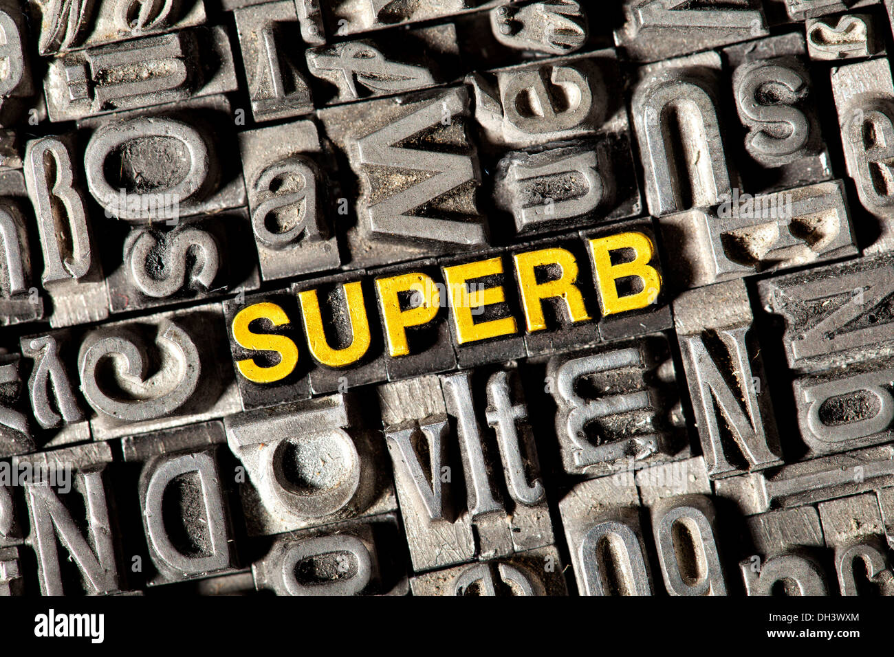Old lead letters forming the word Superb Stock Photo