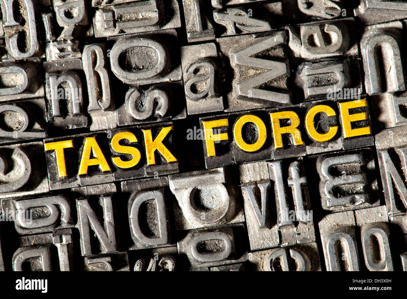 Old lead letters forming the words Task Force Stock Photo