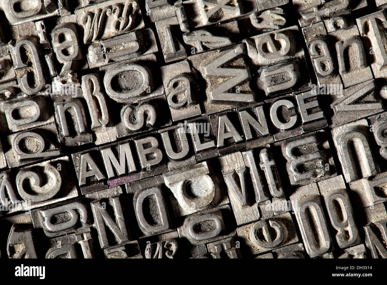 Old lead letters forming the word &quot;AMBULANCE&quot; Stock Photo