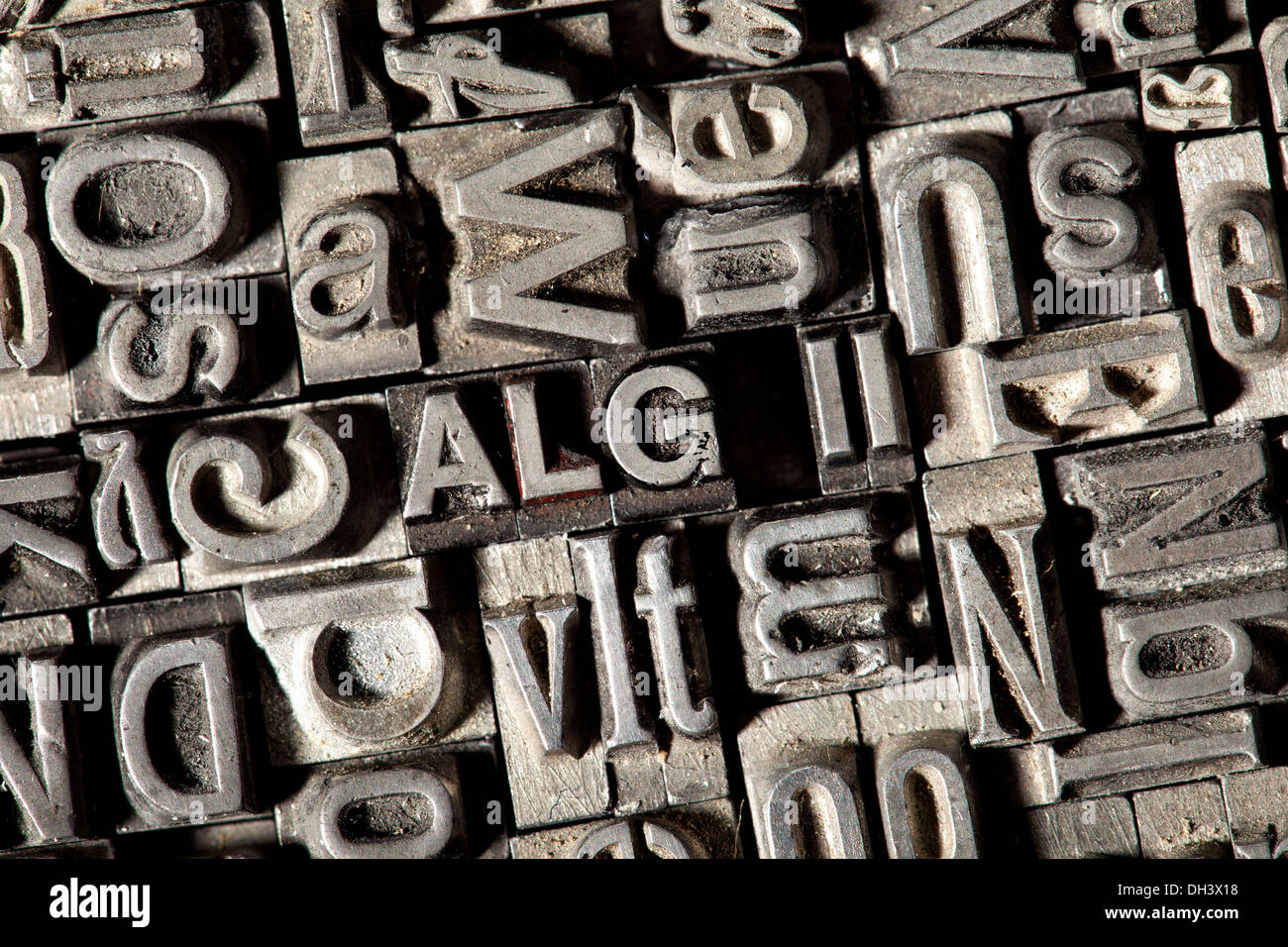 Old lead letters forming the word 'ALG II', German for 'unemployment benefit' Stock Photo