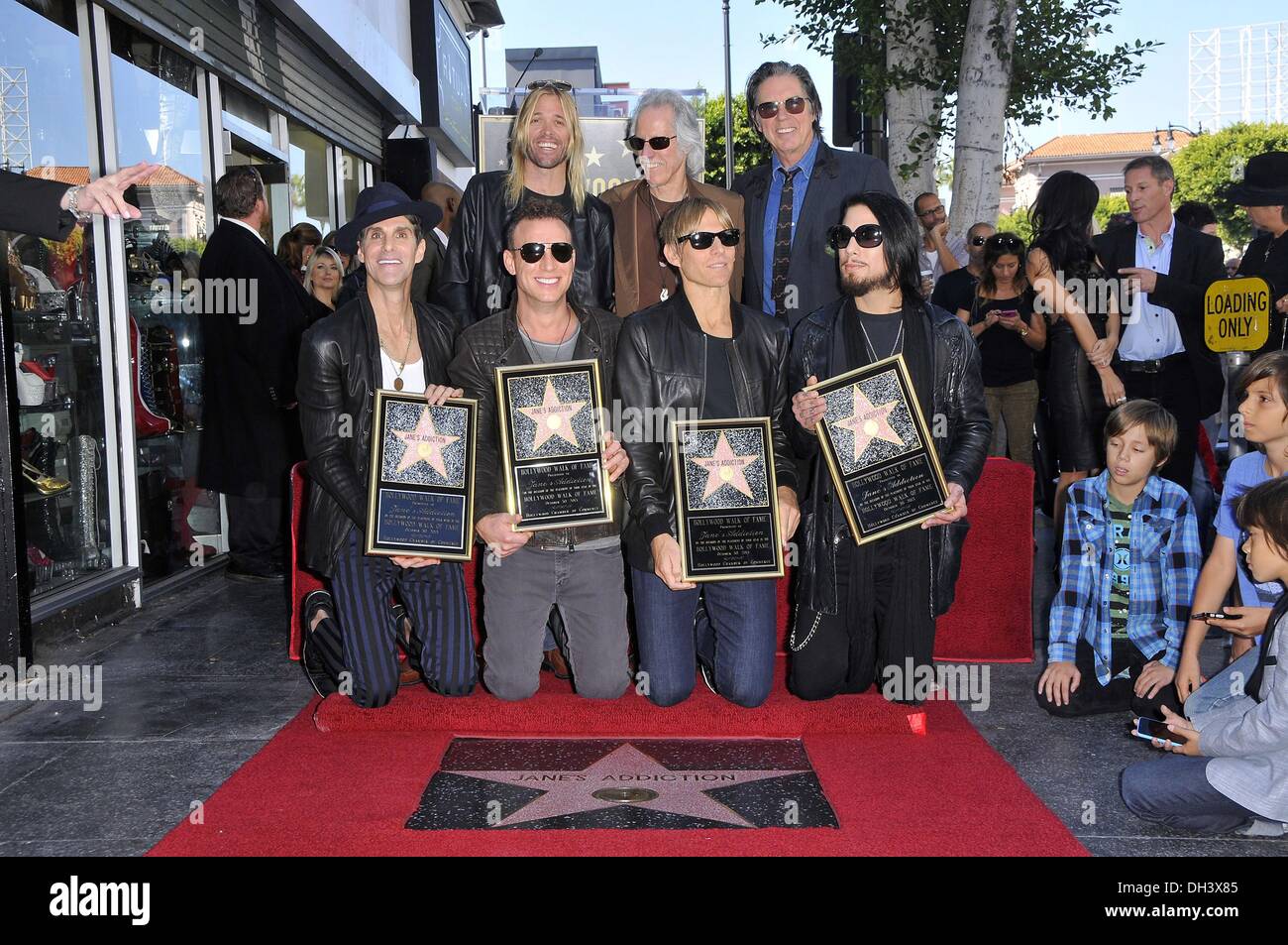 Los Angeles, CA, USA. 30th Oct, 2013. Perry Farrell, Stephen Perkins, Taylor Hawkins, John Densmore, Chris Chaney, John Doe, Dave NavarroJohn Doe, John Densmore, Perry Farrell, Stephen Perkins, Chris Chaney, Dave Navarro at the induction ceremony for Star on the Hollywood Walk of Fame for Jane's Addiction, Hollywood Boulevard, Los Angeles, CA October 30, 2013. Credit:  Michael Germana/Everett Collection/Alamy Live News Stock Photo