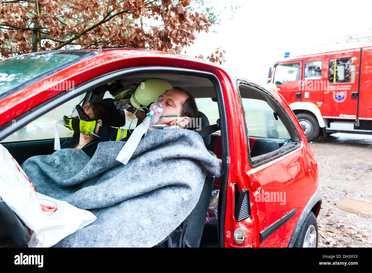 Accident - Fire brigade rescues accident Victim of a car using a hydraulic rescue tool Stock Photo