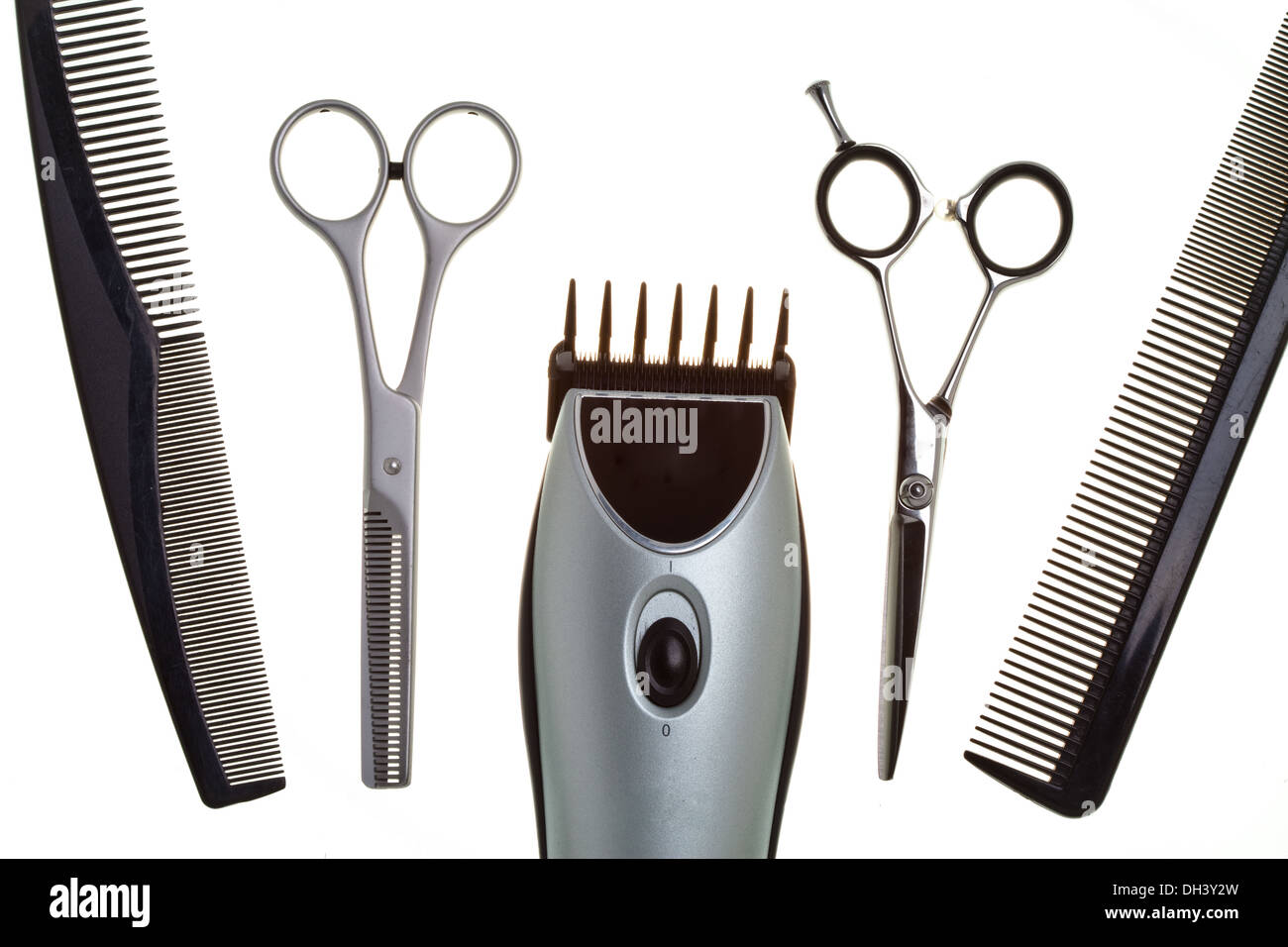Scissors and the machine for a hairstyle Stock Photo Alamy