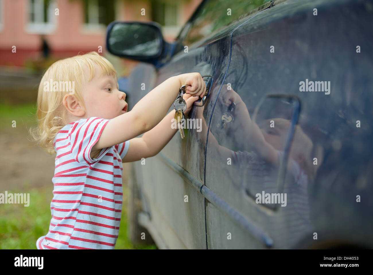 boy opens car Stock Photo