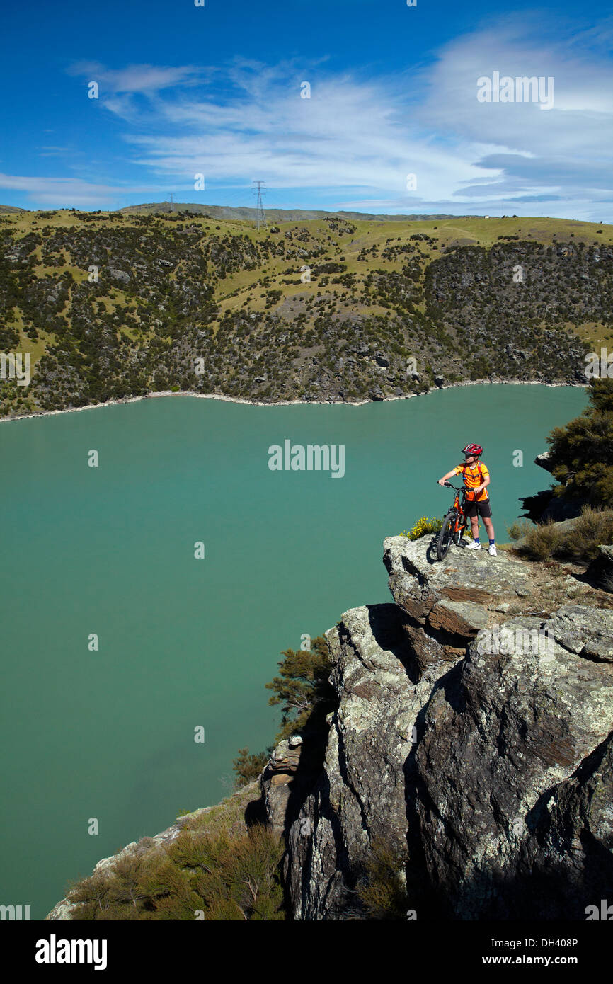 Mountain biker above Lake Roxburgh on Roxburgh Cycle and Walking