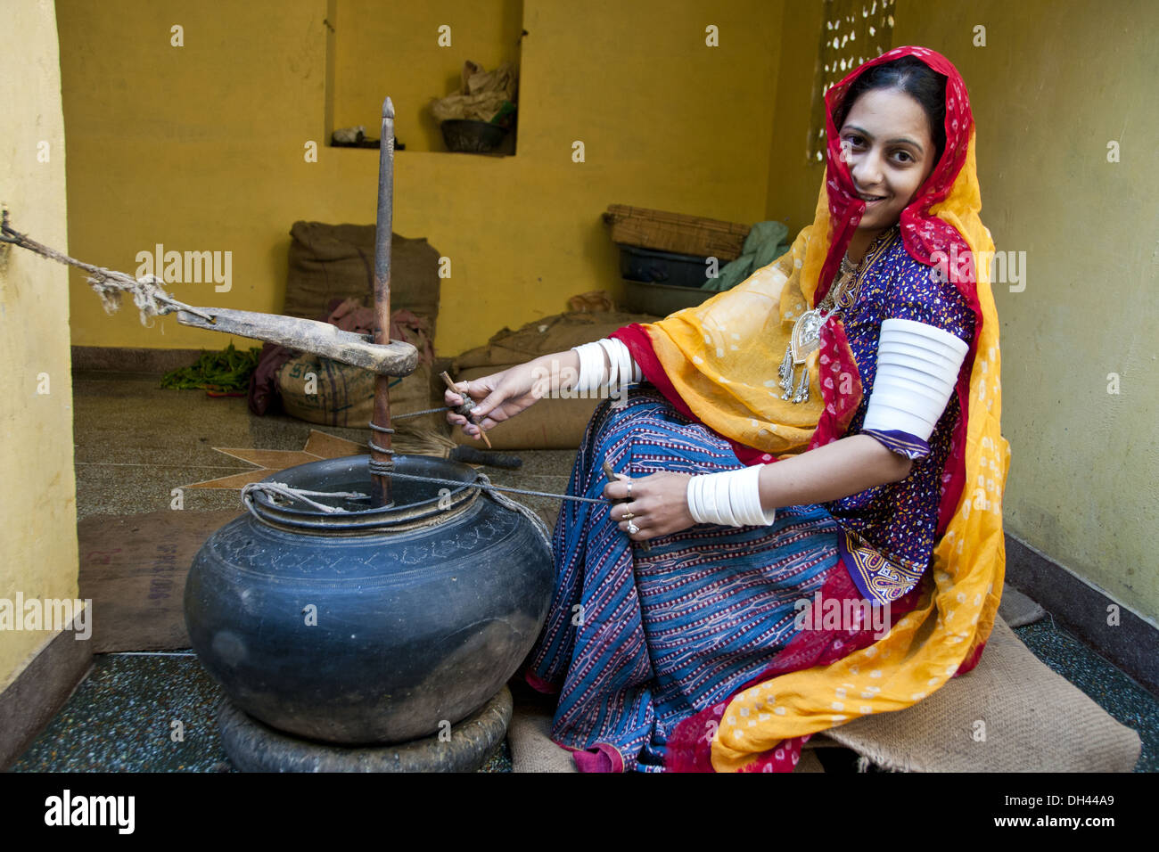 Indian Rajasthani village woman churning butter milk, Jodhpur, Rajasthan, India, Asia, MR#786 Stock Photo