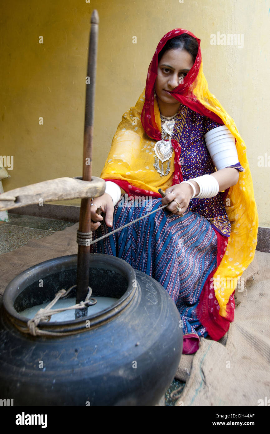 Indian Rajasthani village woman churning butter milk rajasthan India   MR#786 Stock Photo