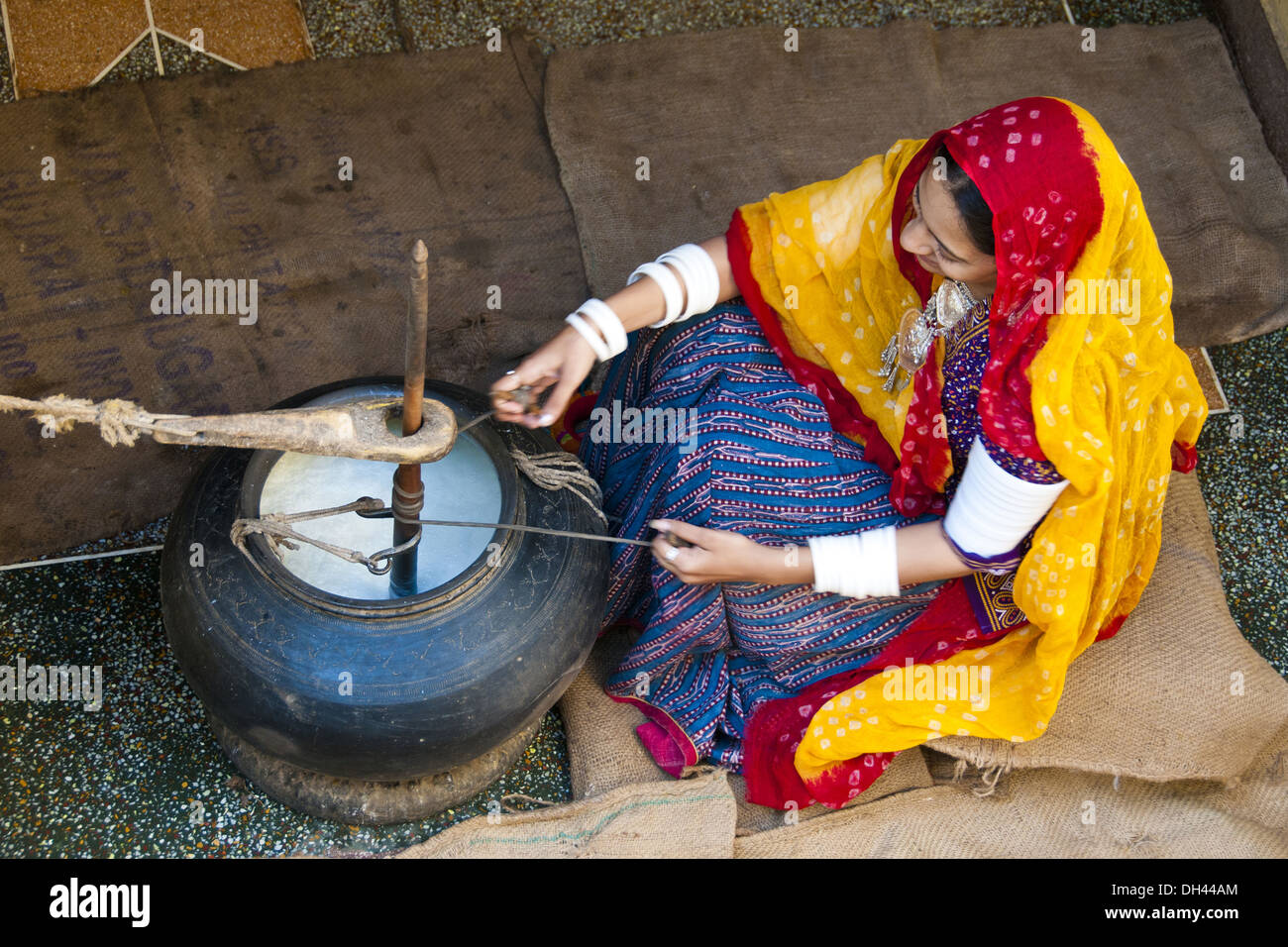 Indian Rajasthani village woman churning butter milk rajasthan India