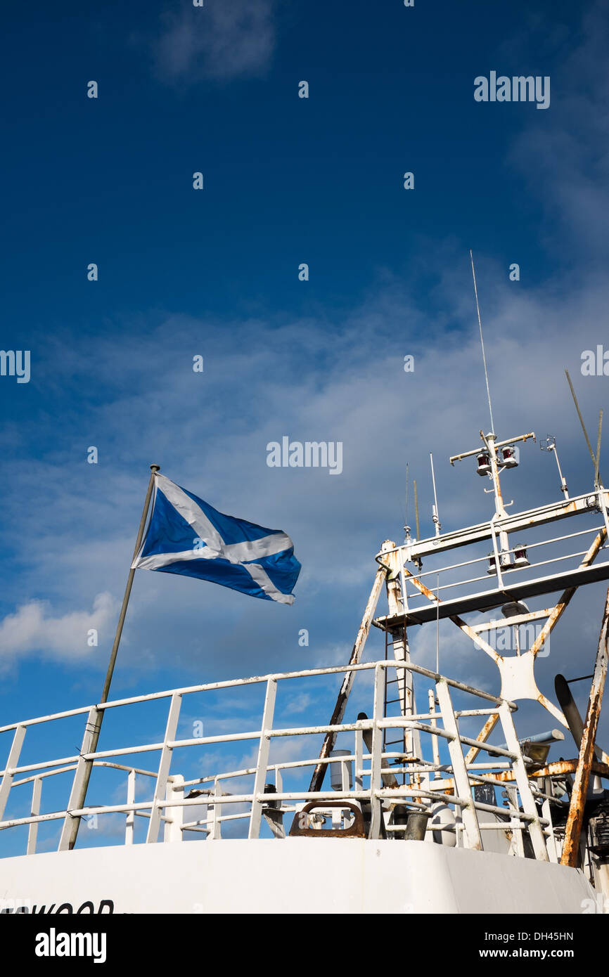 Fishing trawler flying the Scottish flag, the Saltire Stock Photo