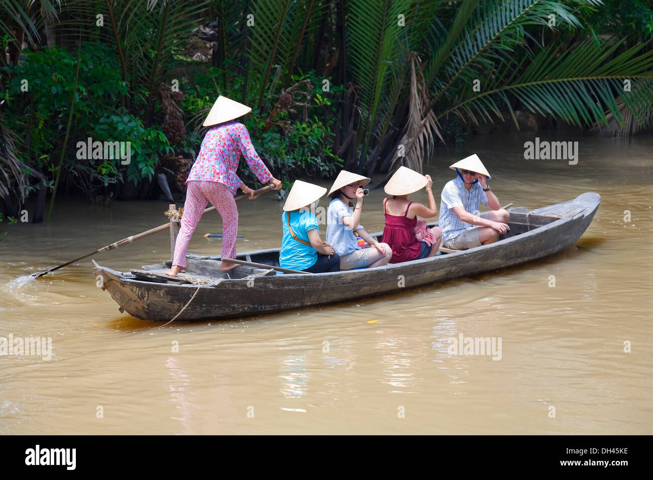 woman rowing in a boat. Mekong delta, Vietnam, Asia Stock Photo - Alamy