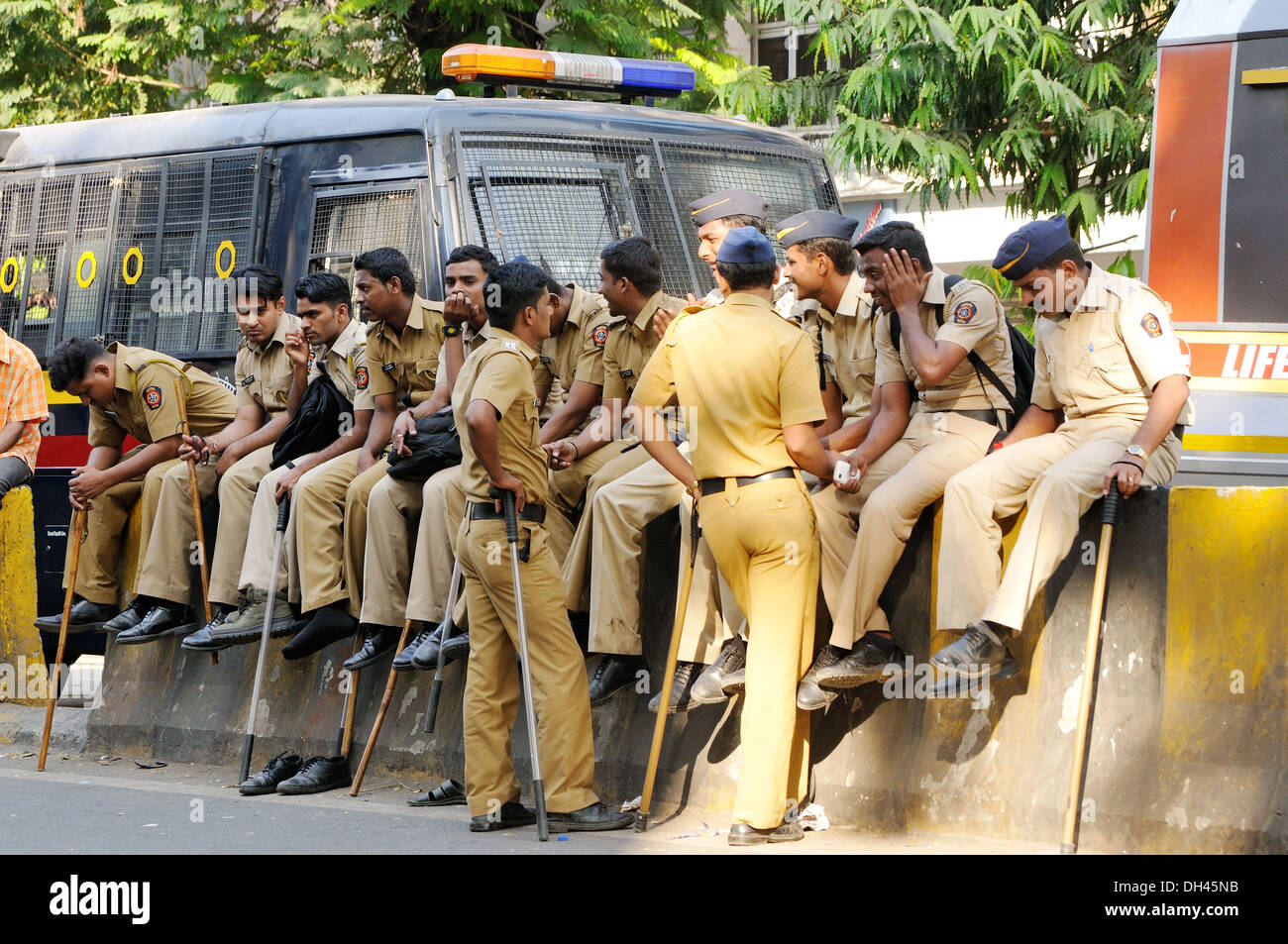 police sitting on road divider for Balasaheb Thackeray funeral procession security mumbai maharashtra india November 2012 Stock Photo