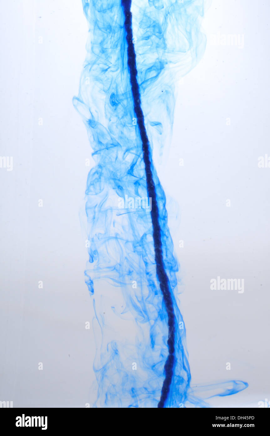 blue color dissolve dissolving spreading line splash in water Stock