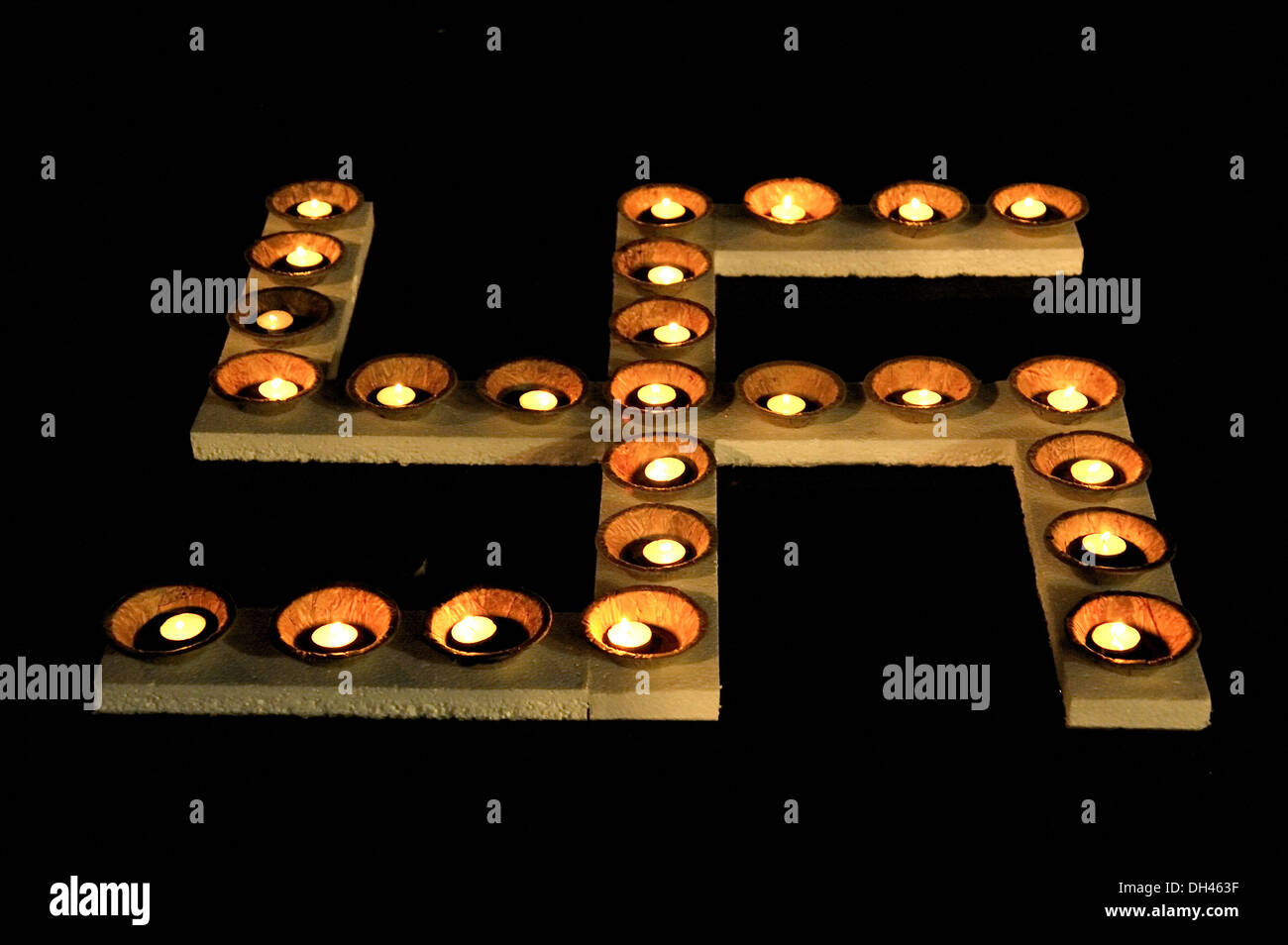 oil lamps burning on swastik symbol Mumbai Maharashtra India Stock Photo