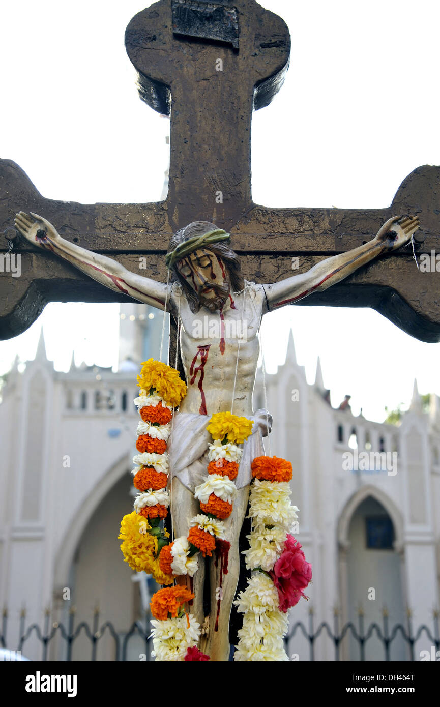 Jesus Christ on cross with garlands , Mount Mary Church , Bandra , Mumbai , Maharashtra , India , asia Stock Photo