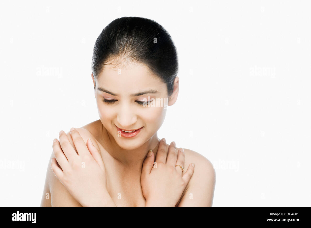 Woman hugging herself Stock Photo
