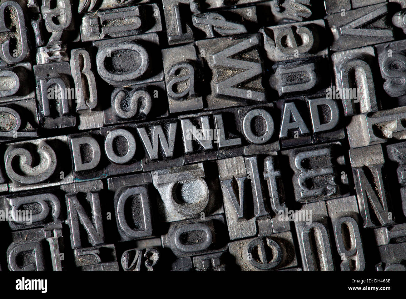 Old lead letters forming the word DOWNLOAD Stock Photo