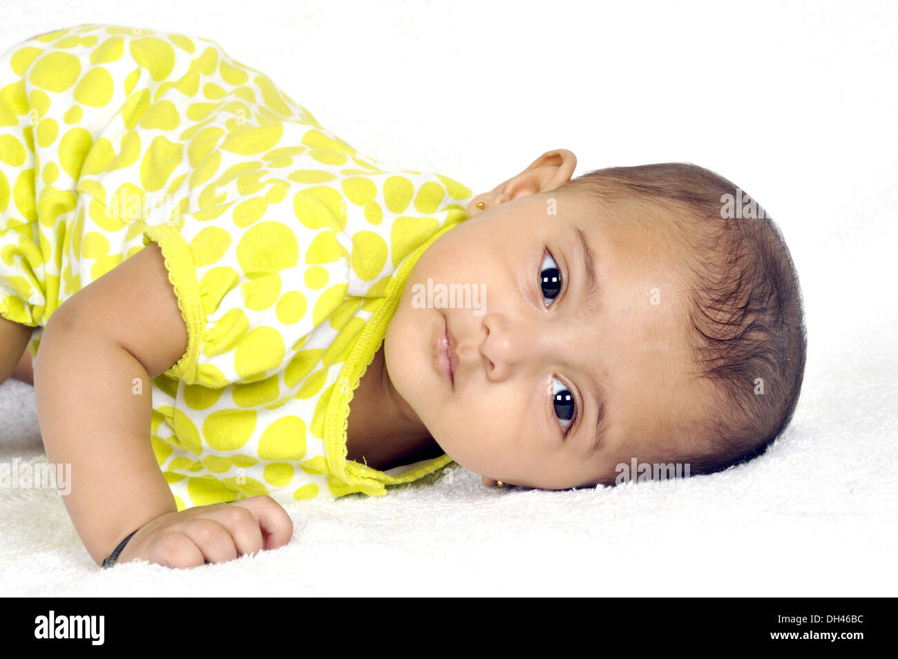 Baby trying to get up on White Background    MR#736LA Stock Photo