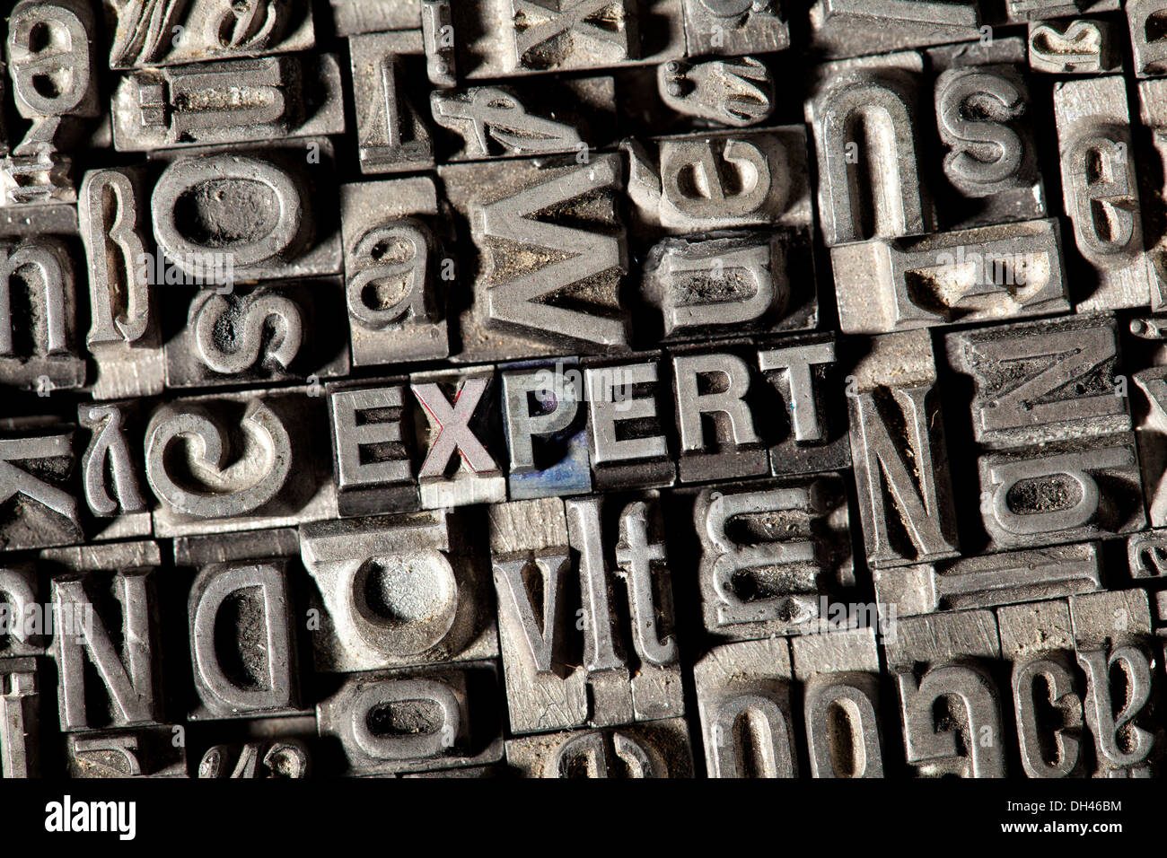 Old lead letters forming the word EXPERT Stock Photo