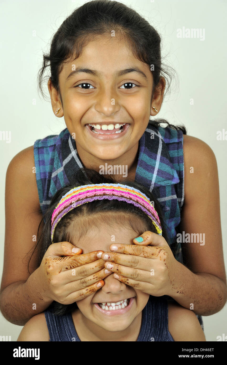 Two sisters play games - a Royalty Free Stock Photo from Photocase