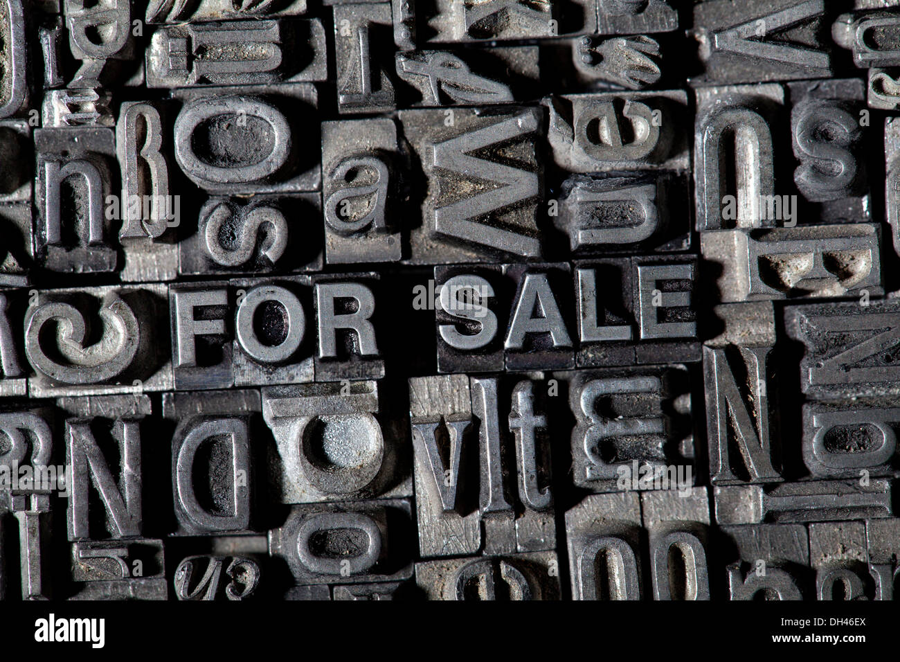 Old lead letters forming the term FOR SALE Stock Photo