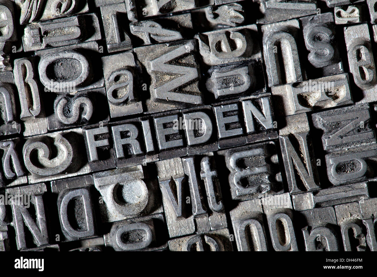 Old lead letters forming the word FRIEDEN, German for peace Stock Photo