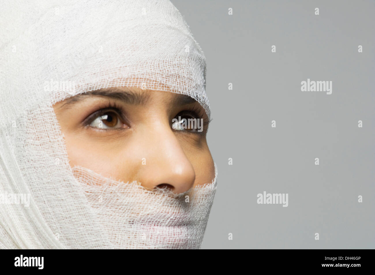 Wrapped face woman bandage hi-res stock photography and images - Alamy