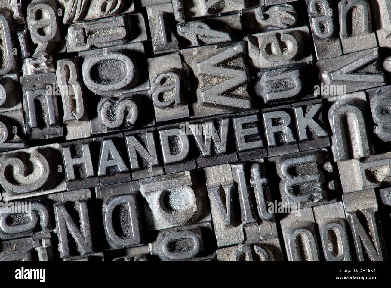 Old lead letters forming the word HANDWERK, German for handicraft Stock Photo