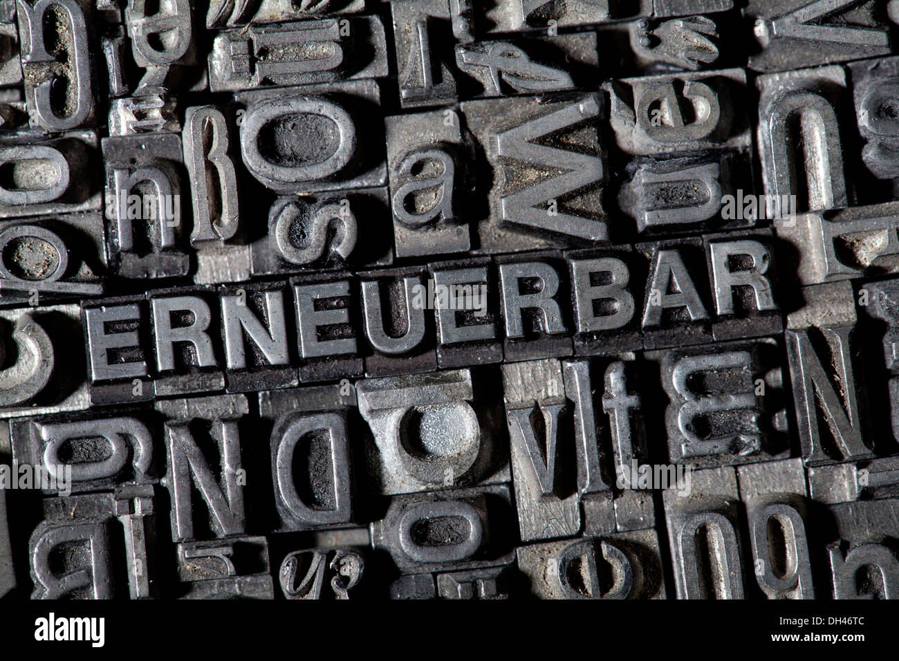 Old lead letters forming the word ERNEUERBAR, German for renewable Stock Photo