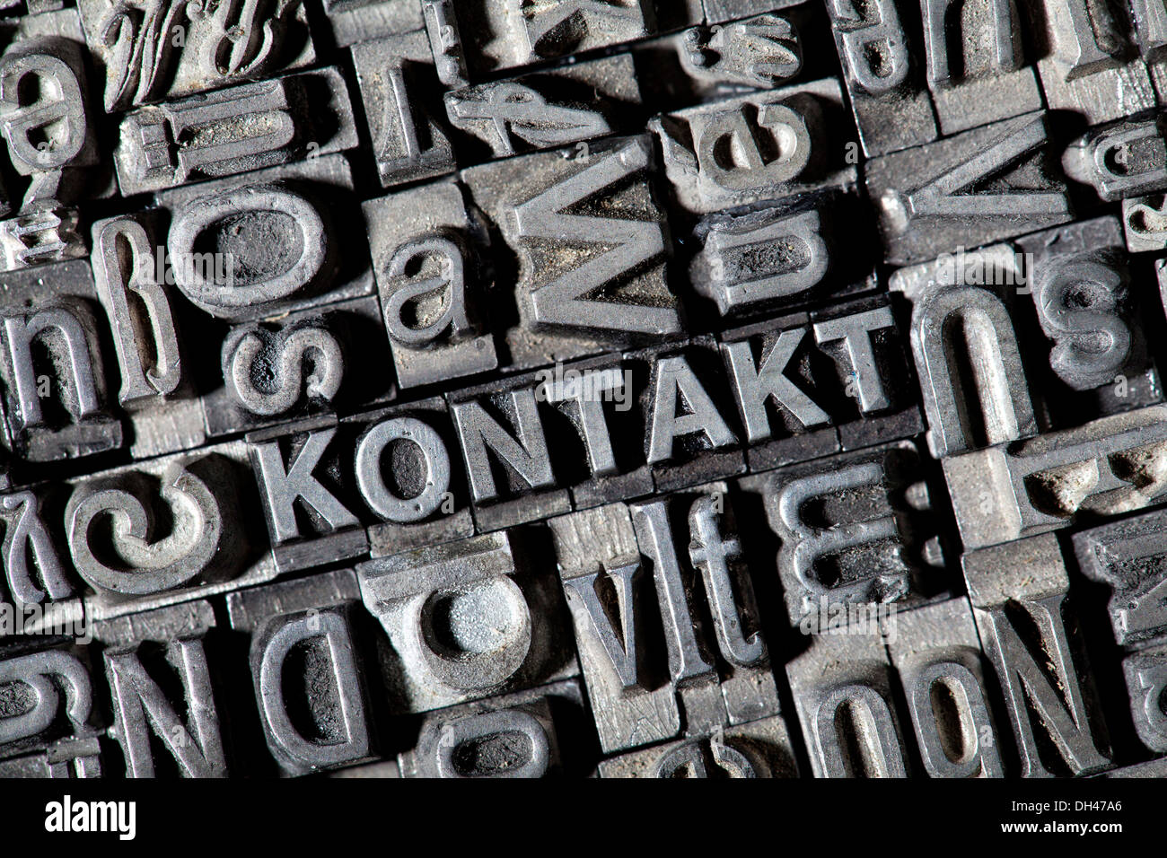 Old lead letters forming the word 'KONTAKT', German for 'CONTACT' Stock Photo