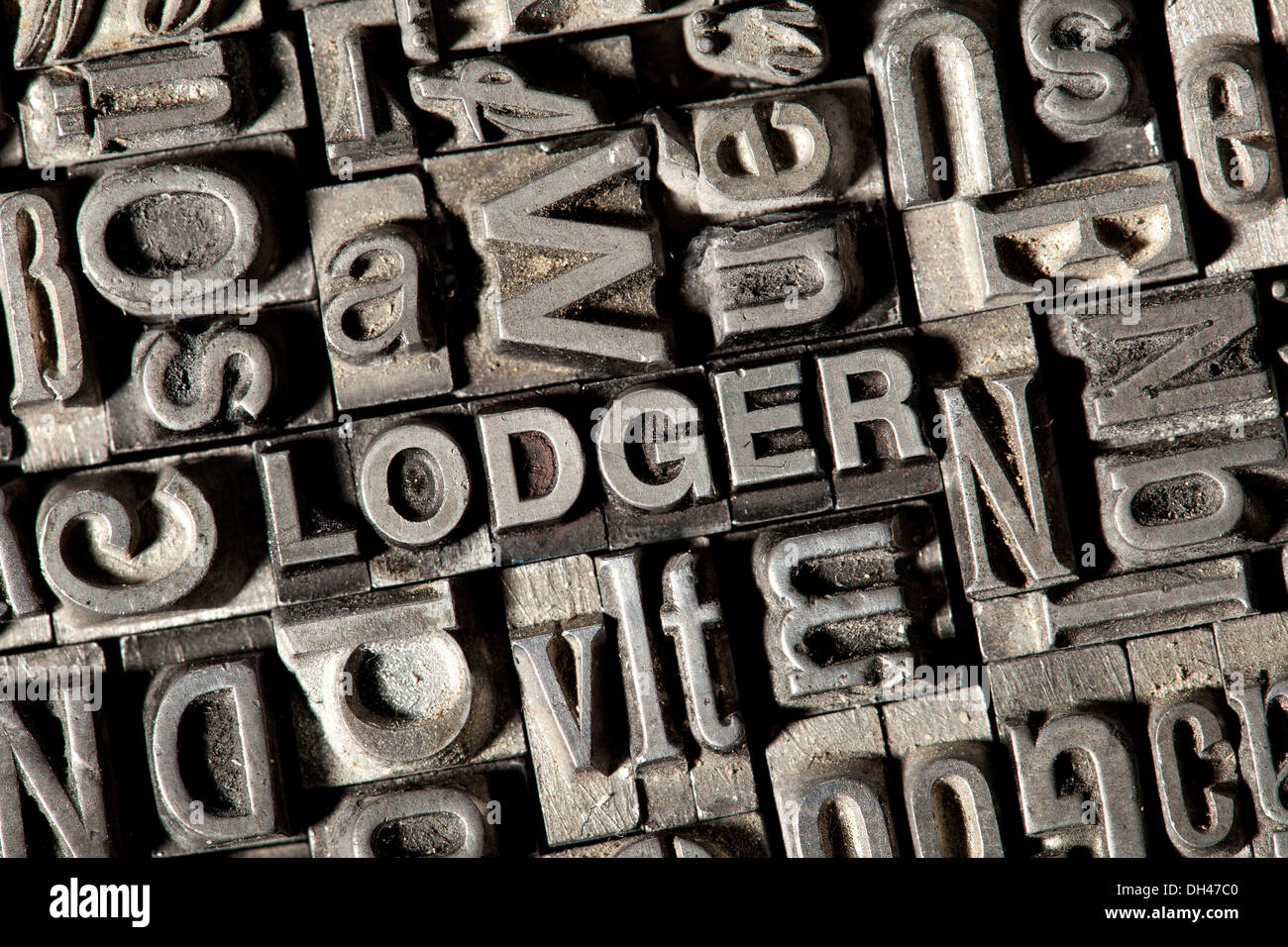 Old lead letters forming the word &quot;LODGER&quot; Stock Photo