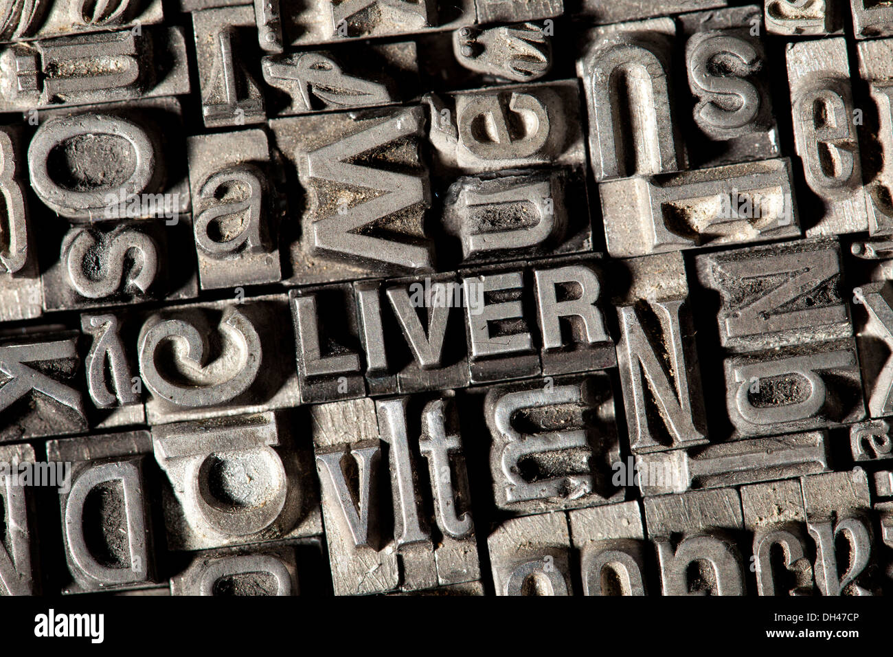 Old lead letters forming the word &quot;LIVER&quot; Stock Photo