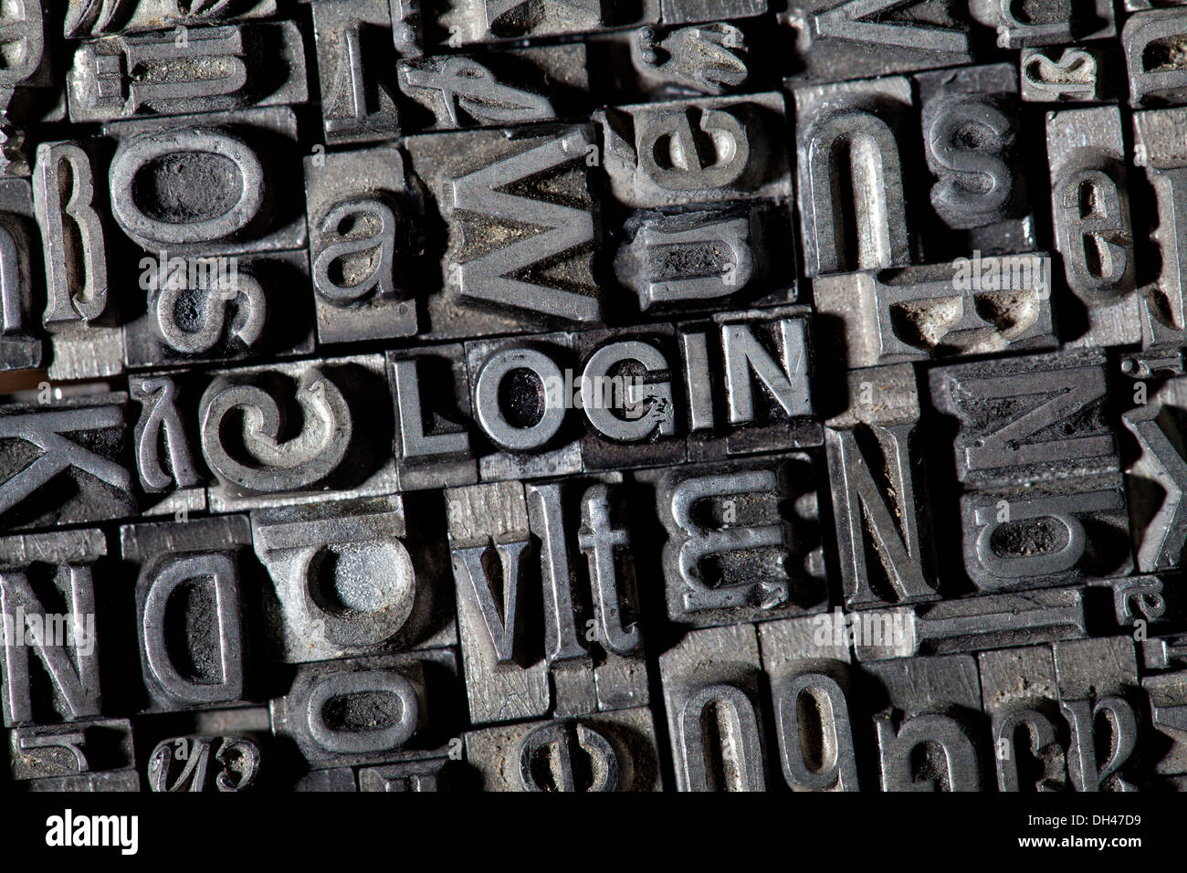 Old lead letters forming the word 'LOGIN' Stock Photo
