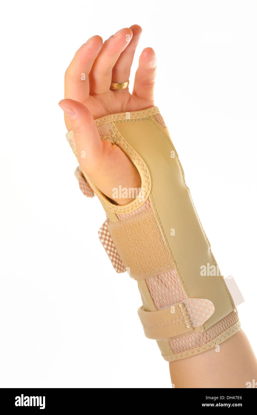 hand with a orthopedic wrist brace Stock Photo