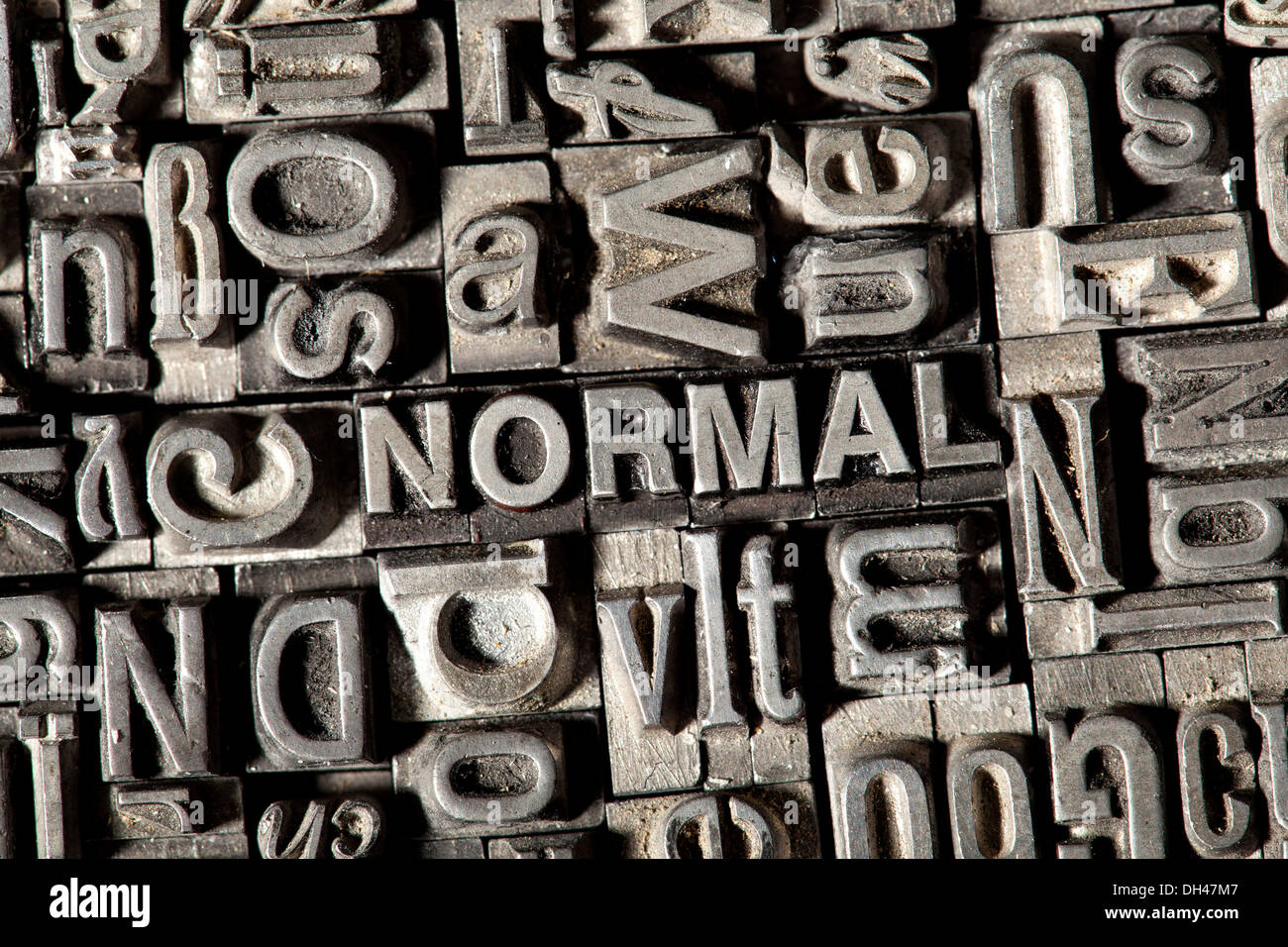 Old lead letters forming the word NORMAL Stock Photo
