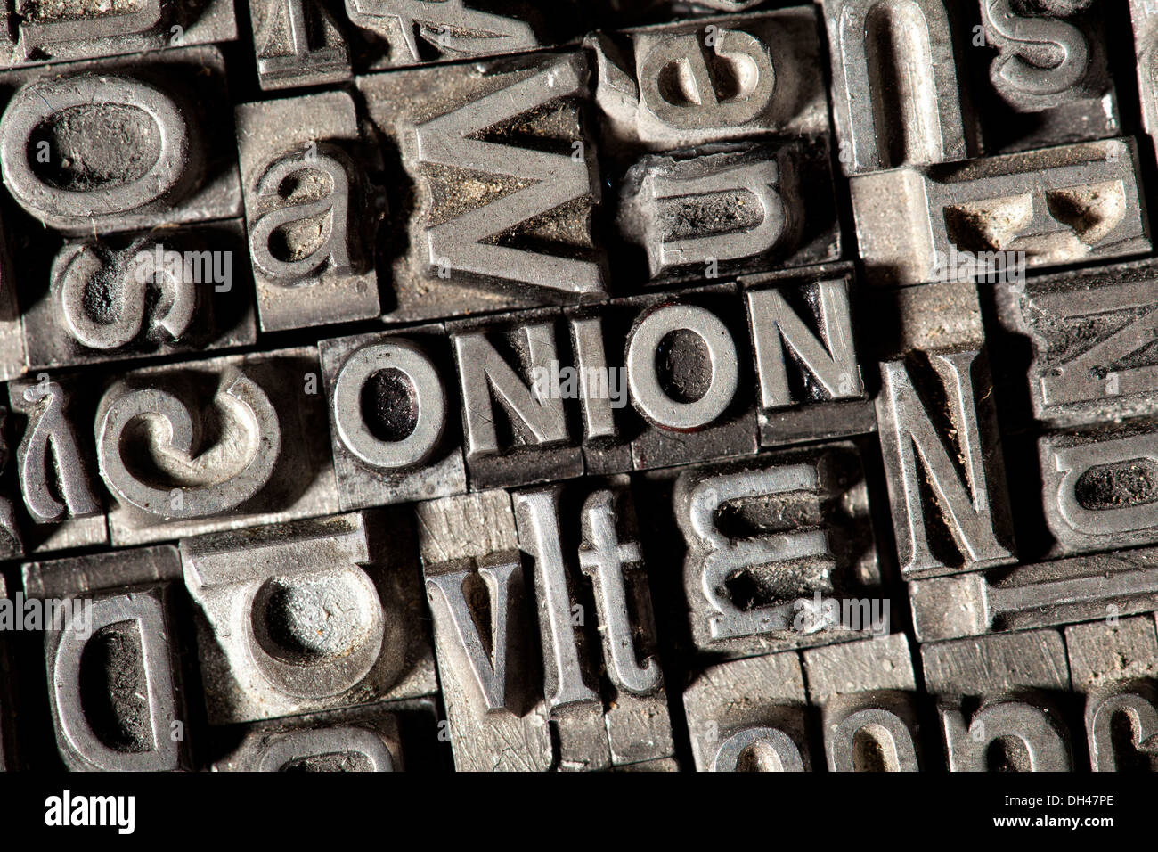 Old lead letters forming the word ONION Stock Photo