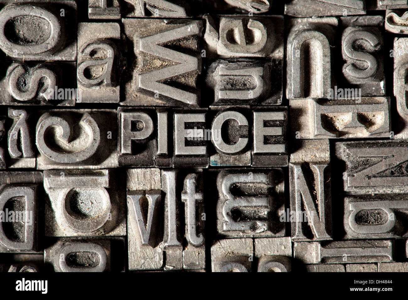 Old lead letters forming the word "PIECE Stock Photo Alamy