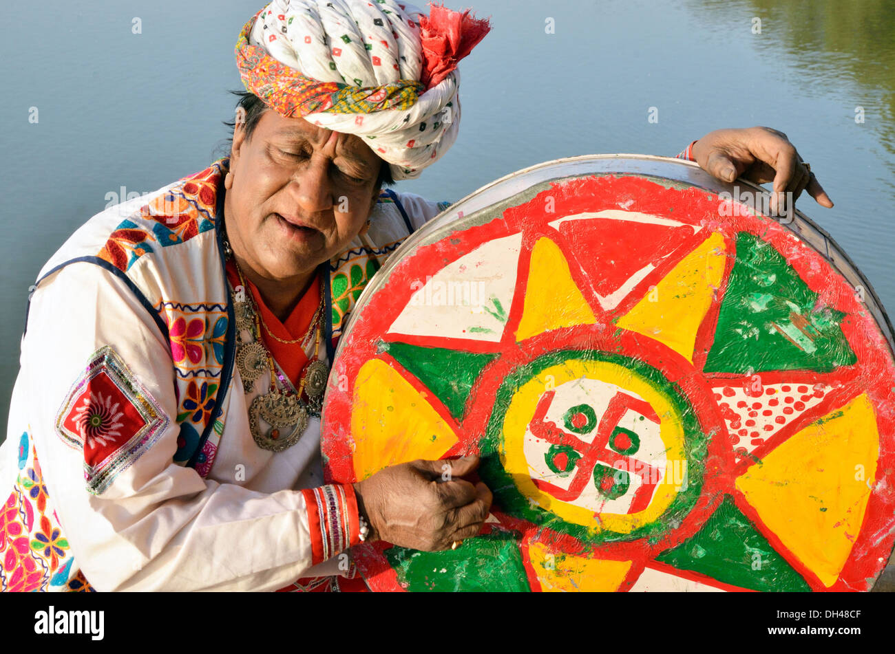 Folk singer playing musical instrument Gadisar Lake Rajasthan India