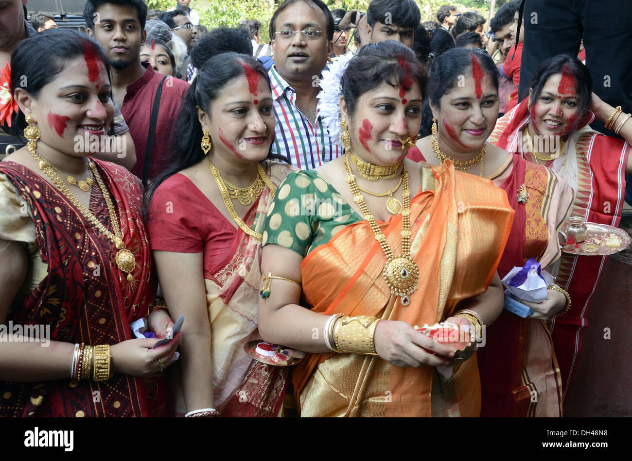 Bengali women with sindur on cheeks forehead on Durga puja festival at Kolkata west bengal India Stock Photo