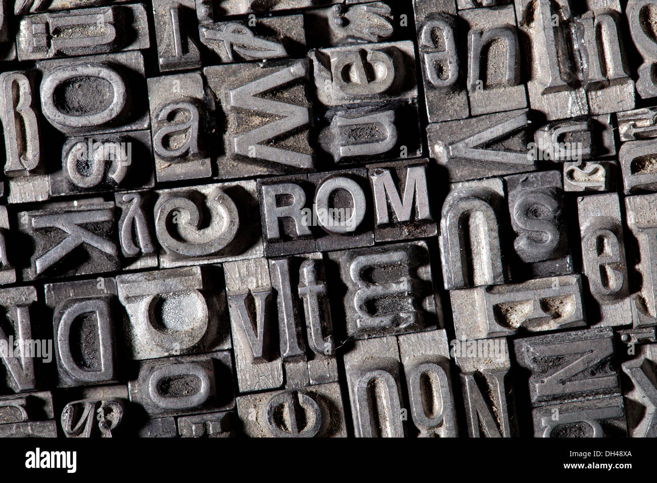 Old lead letters forming the word ROM Stock Photo