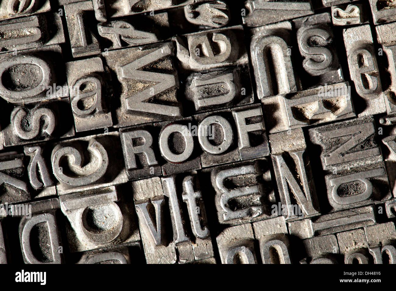 Old lead letters forming the word ROOF Stock Photo