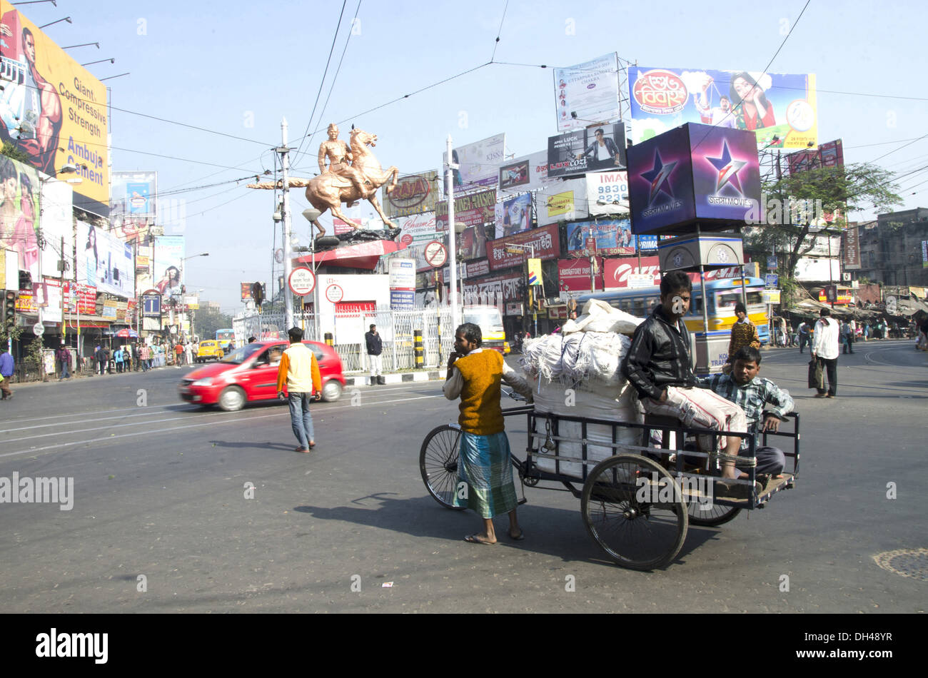 tricycle carrying loaded with sacks at kolkata West Bengal India Stock
