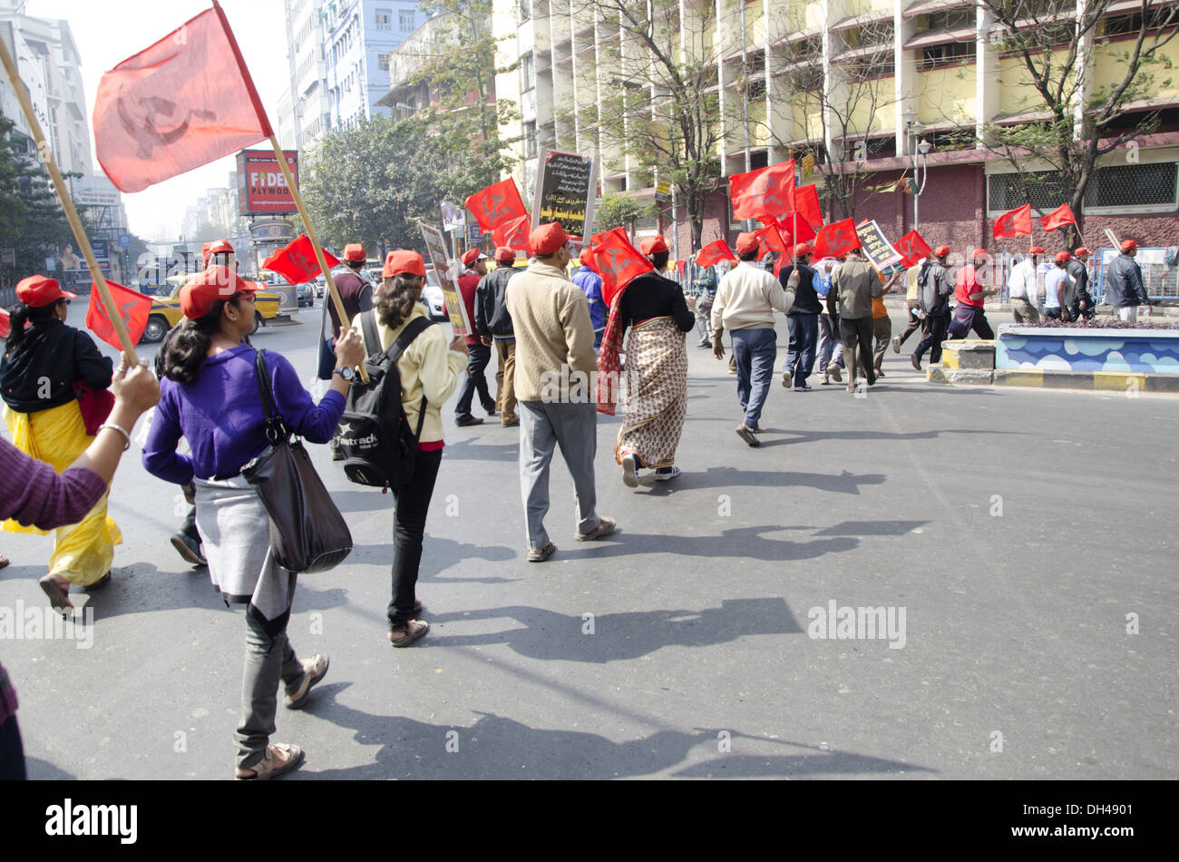 Red flag demonstration procession rally of left political parties on road at Calcutta Kolkata West Bengal India Asia Stock Photo